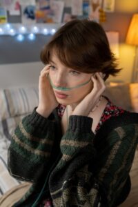 Adult patient using home oxygen equipment as part of pulmonary fibrosis care